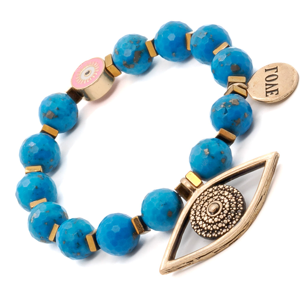 The Turquoise Love Bracelet combines elegance and protection, featuring a large bronze evil eye charm and turquoise stone beads.