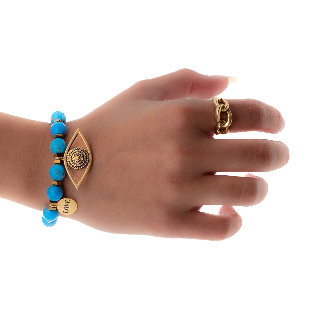 The hand model showcases the Turquoise Love Bracelet, radiating elegance and protection with every movement.