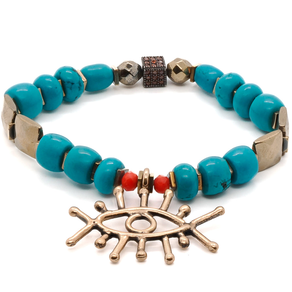 The Turquoise Long Lash Bracelet combines elegance and spiritual energy, featuring turquoise beads, a sparkling Swarovski crystal, hematite, and a brass evil eye charm.