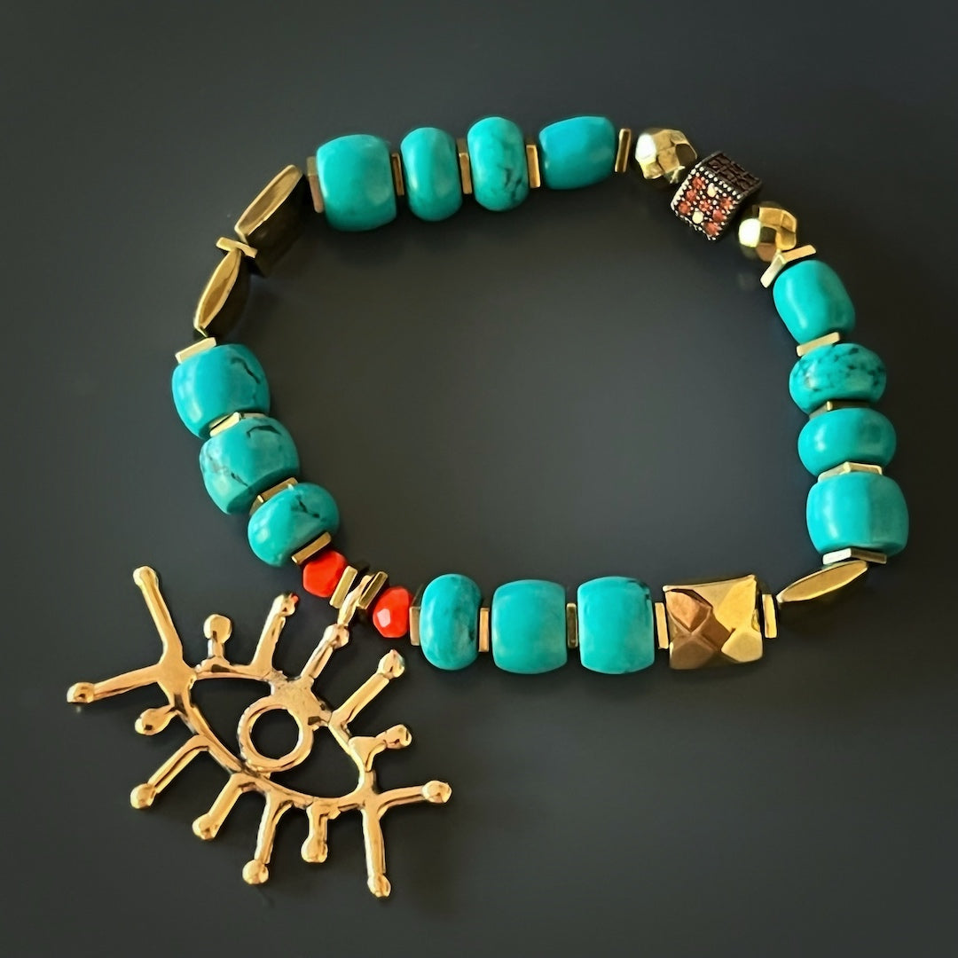Discover the perfect blend of elegance and spiritual symbolism with the Turquoise Long Lash Bracelet, featuring turquoise beads, a Swarovski crystal, hematite, and a brass evil eye charm.
