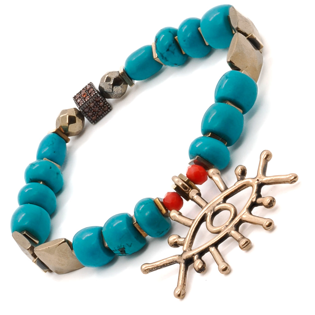 Elevate your style with the Turquoise Long Lash Bracelet, showcasing the unique combination of turquoise beads, a Swarovski crystal, hematite, and a brass evil eye charm.