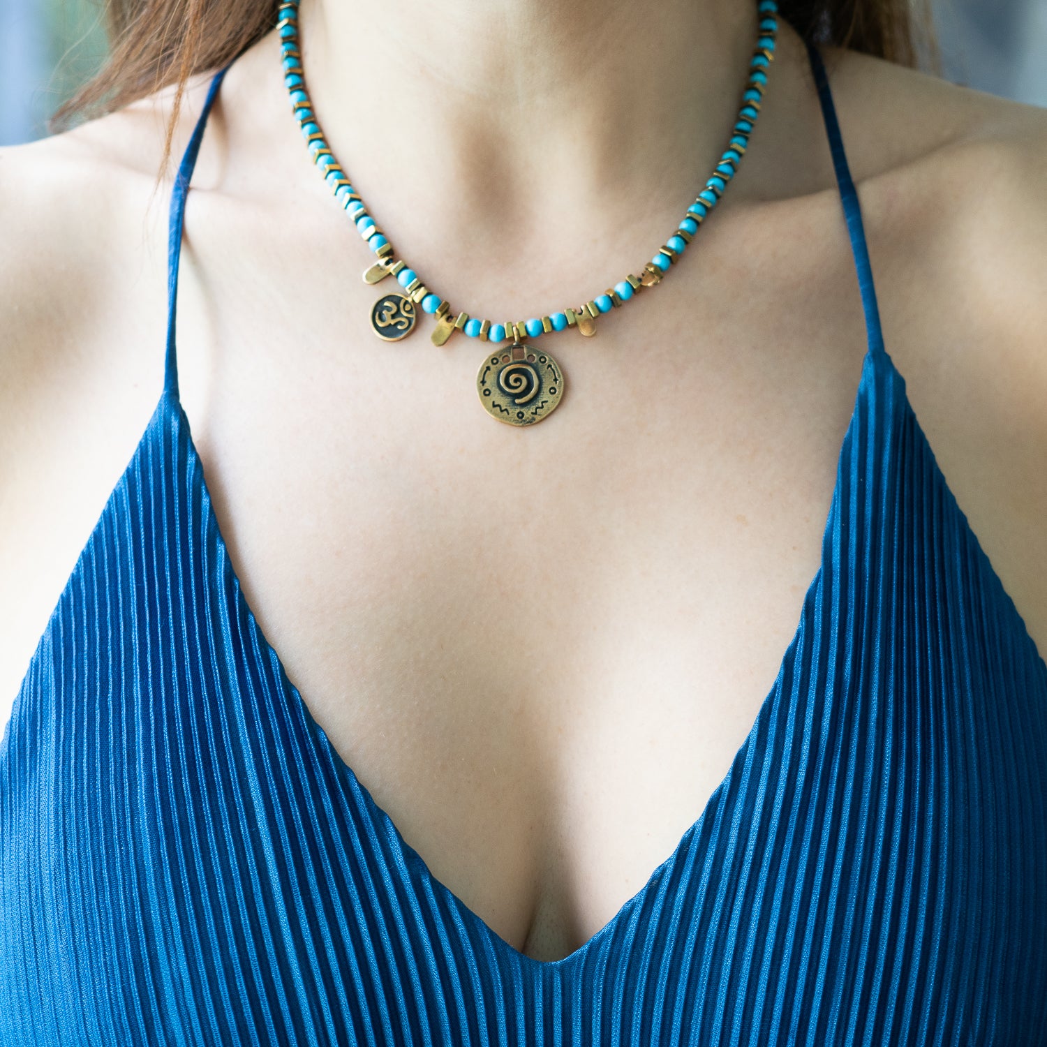Model wearing the Turquoise Spiral Necklace, exuding a sense of calmness and embracing the positive energy it represents.