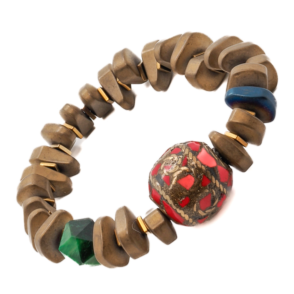 Explore the beauty of the Vintage Nepal Bracelet, adorned with matte gold hematite beads and a stunning red and gold Nepal bead.