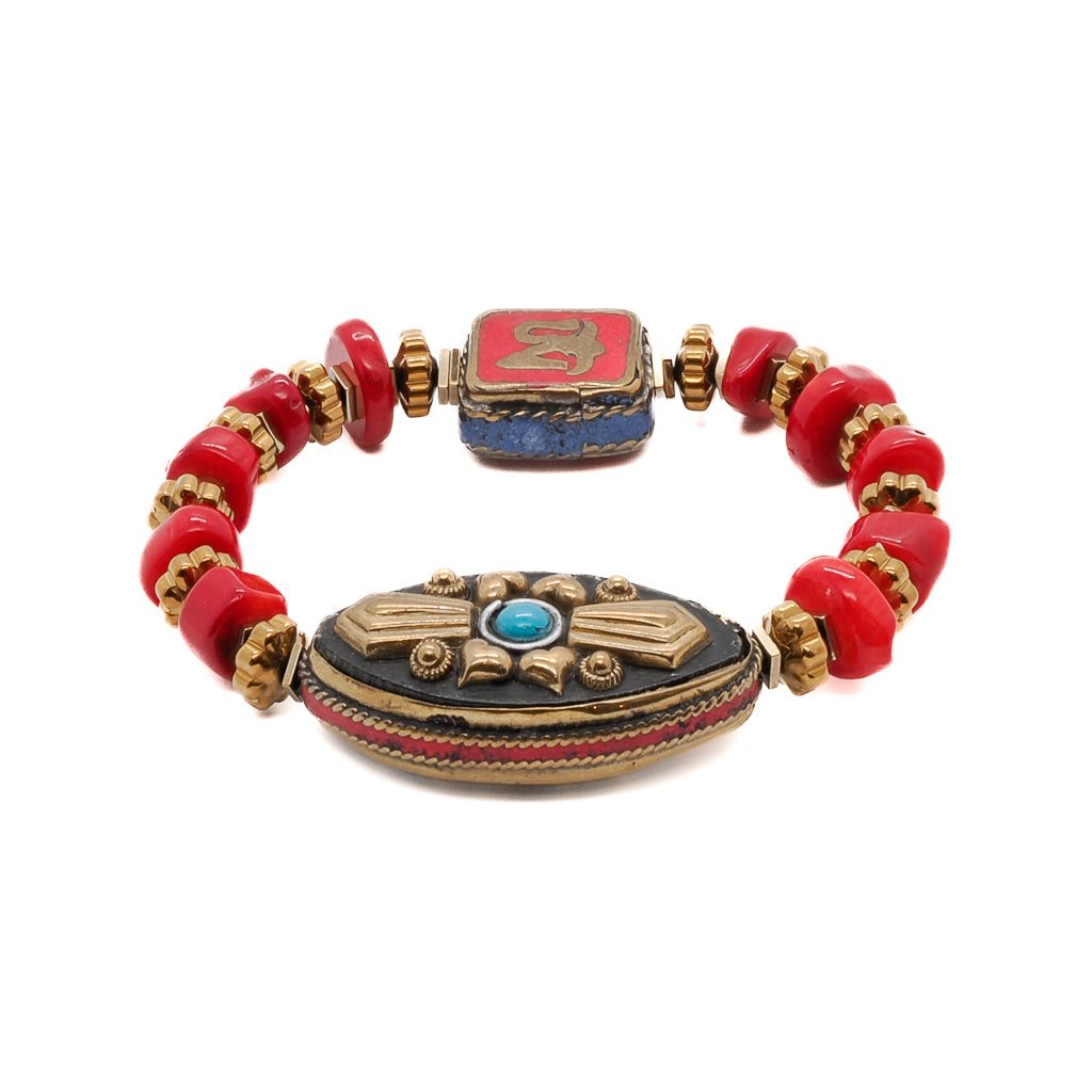 Discover the vintage-inspired beauty of the Vintage Style Ethnic Om Bracelet, featuring red coral beads and a handmade Nepalese charm.