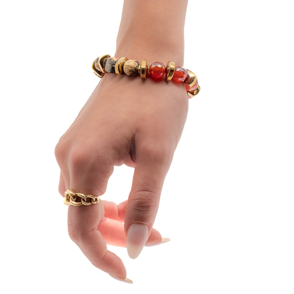 The model&#39;s wrist is adorned with the Vintage Style Nepal Bracelet, a captivating piece that brings joy and positivity