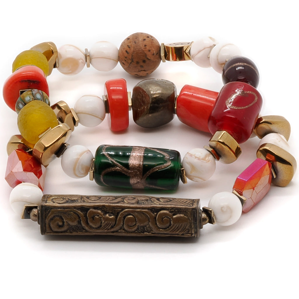 Explore the cultural richness of the Vintage Style Tibetan Bracelet Set, featuring Tibetan bone beads, African beads, and coral stones.