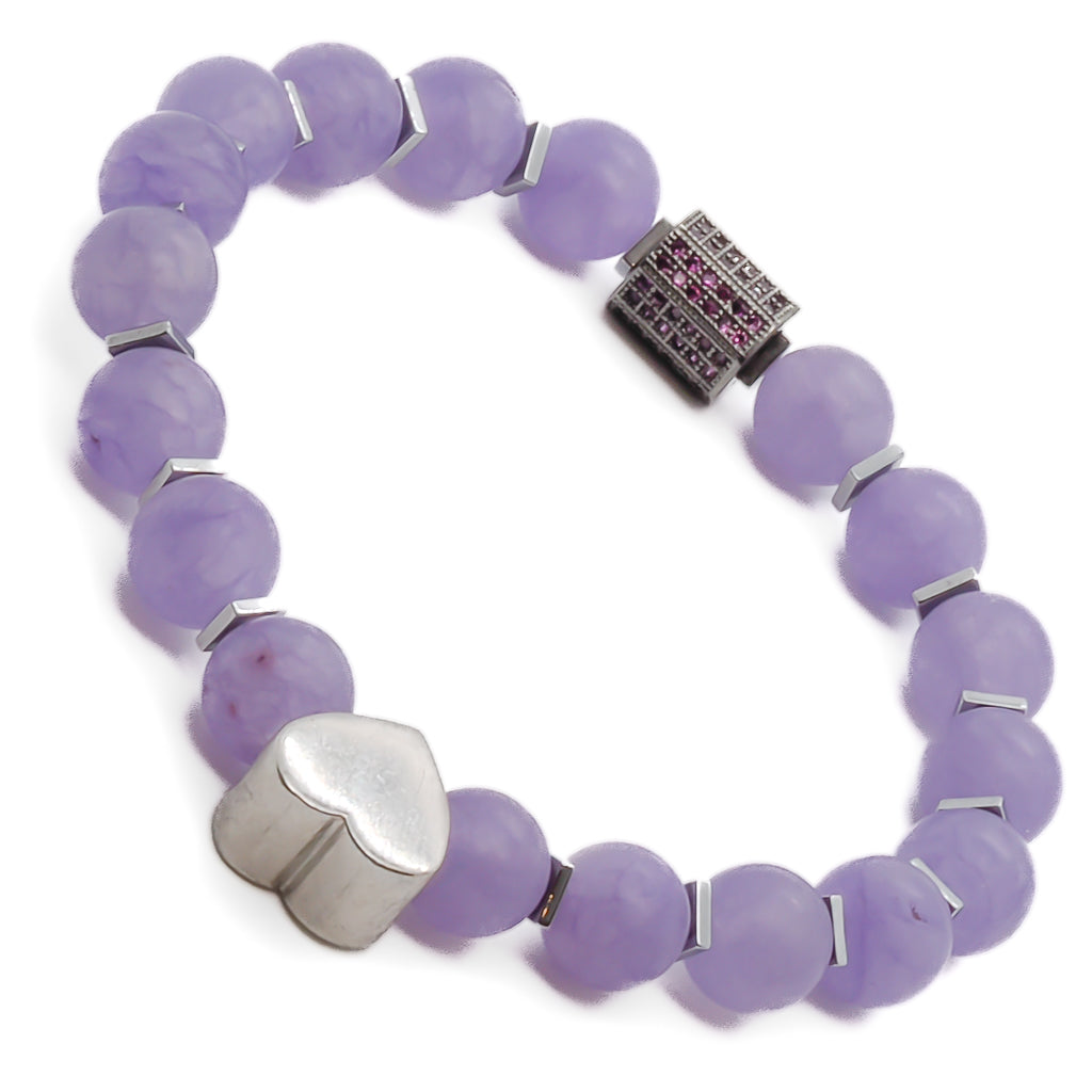 Explore the healing properties and beauty of the Violet Love Bracelet, crafted with purple jade beads, sterling silver heart charms, and a mesmerizing Swarovski crystal accent.