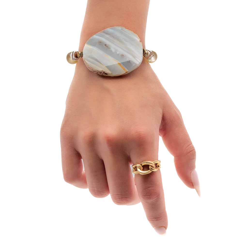 Embrace the beauty of the Yellow Chunky Agate Bracelet as the hand model wears it, showcasing its unique design and eye-catching gemstones.