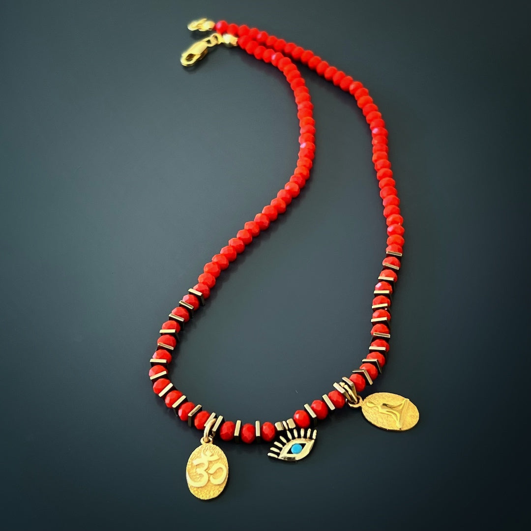 Mystic Yoga Girl Choker Necklace adorned with powerful symbols and red crystal beads.