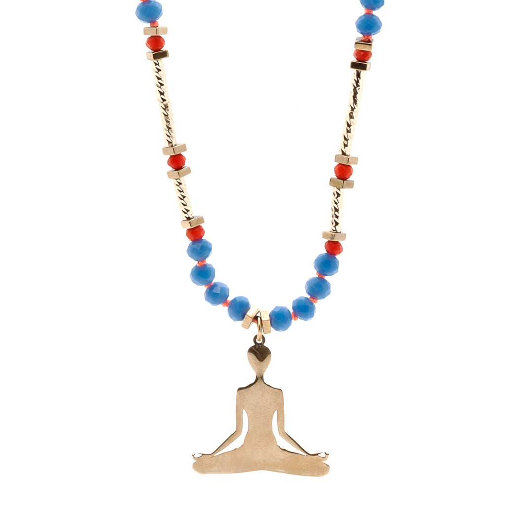 Yoga Meditation Necklace featuring a combination of blue and red Nepal beads, gold-plated tube beads, and a sterling silver meditation pendant.