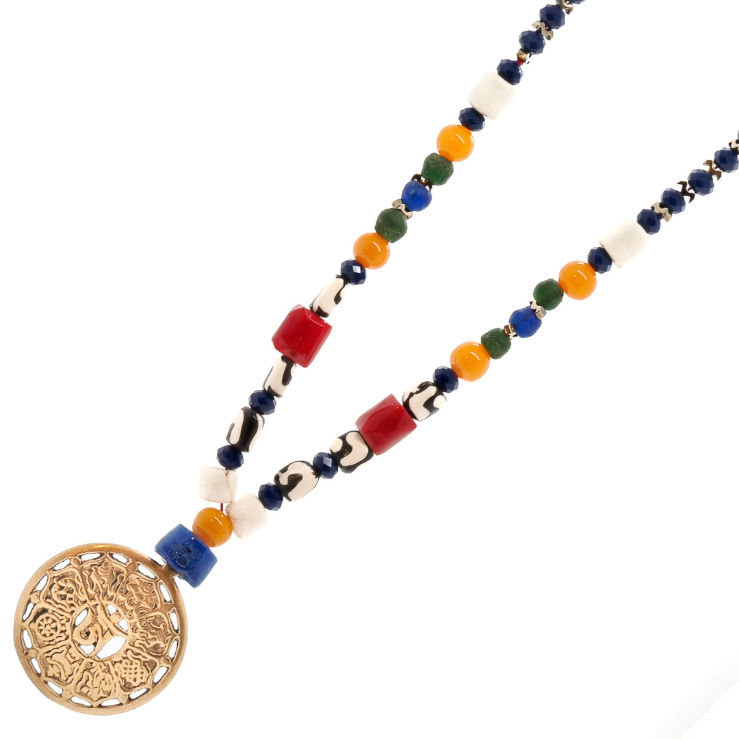 Experience the beauty of the Yoga Necklace, adorned with blue crystal beads and a gold-plated OM pendant.