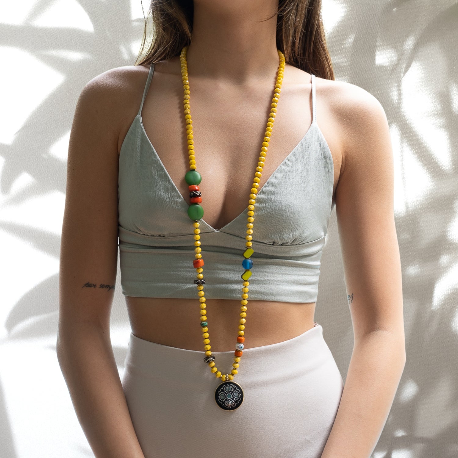 Model showcasing the vibrant and spiritual Yoga Serenity Necklace with grace and confidence.