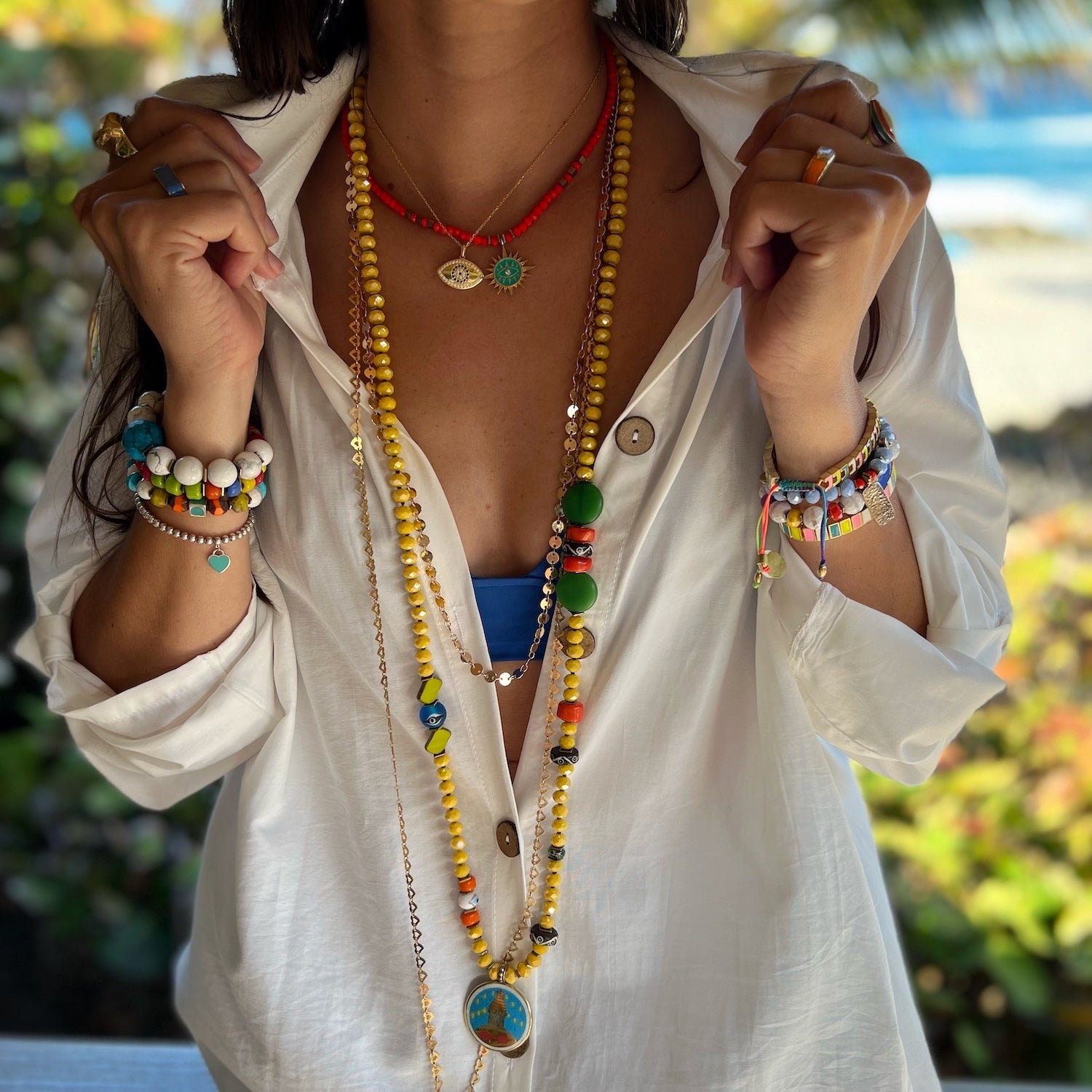 The model exudes positive energy while wearing the Yoga Serenity Necklace, a perfect match for their yoga practice.