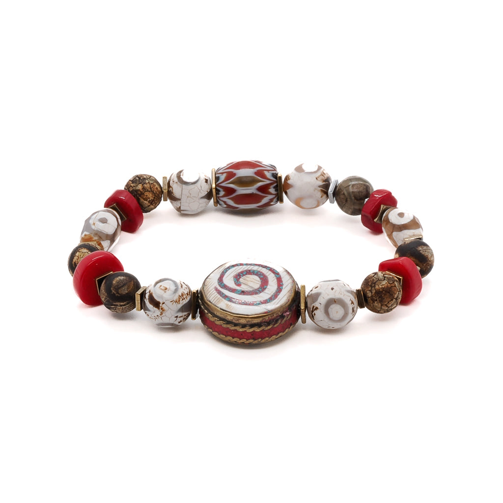 Discover the mystical essence of the Yoga Spirit Mystic Bracelet, featuring coral stone beads, Nepal meditation beads, and gold color hematite spacers.