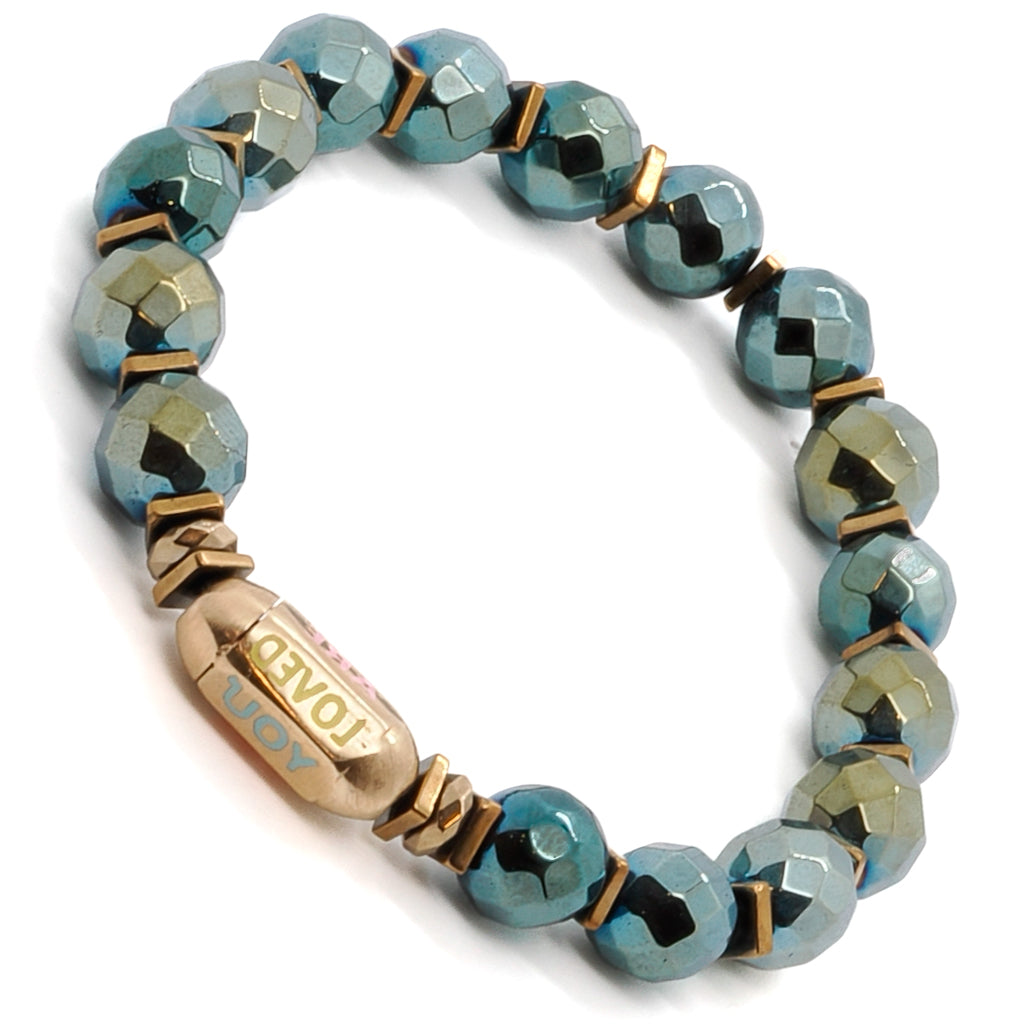 Experience the grounding and balancing energy of the You Are Loved Bracelet, adorned with green hematite stone beads and a stunning "You Are Loved" tube bead.